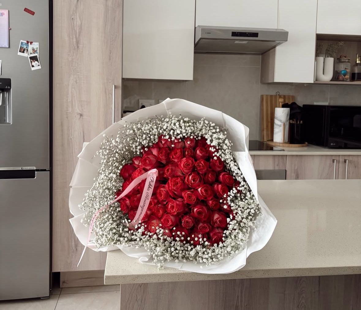 50 Roses with white gyp