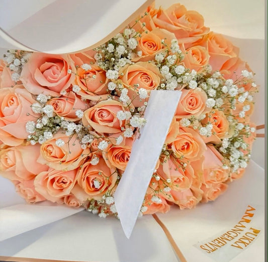 40 peach roses with white gyp